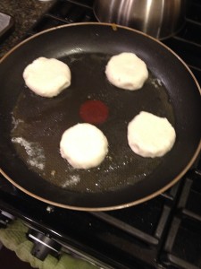 arepas in the skillet